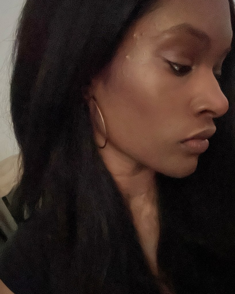 Mac Mineralize Skin Finish Highlighter on a person with brown skin.