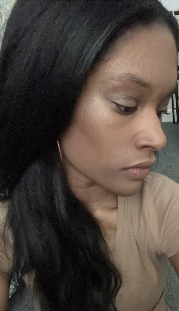 Mac Mineralize skin finish Gold Deposit on a person with brown skin.
