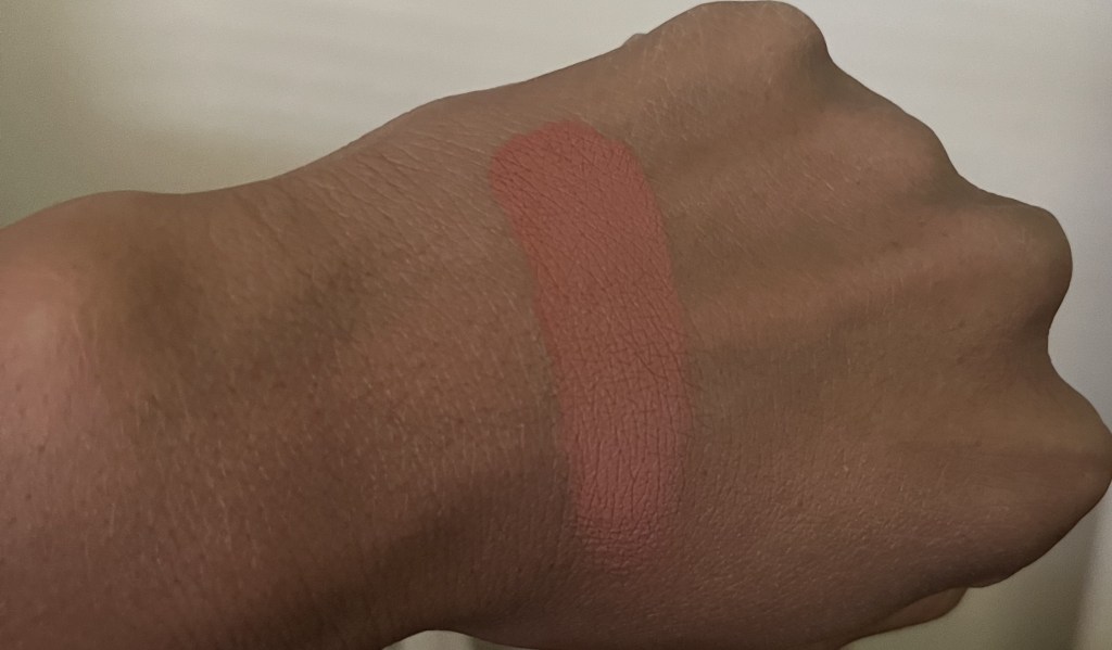 Mac Raizin powder blush swatched on brown skin.