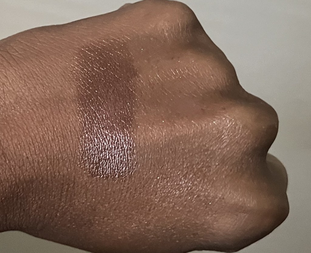 Revlon Iced Mocha swatched on brown skin.